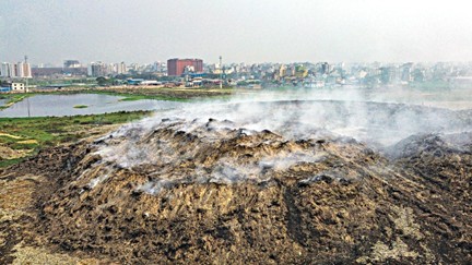 The Matual landfill under the Dhaka South Urban Corporation, which is fueled by waste materials such as plastic and polyethylene , continues to smoke. Locals say the stench and smoke are too bad. This drone photo was recently taken of smoke rising from a garbage pile about 25 feet high .